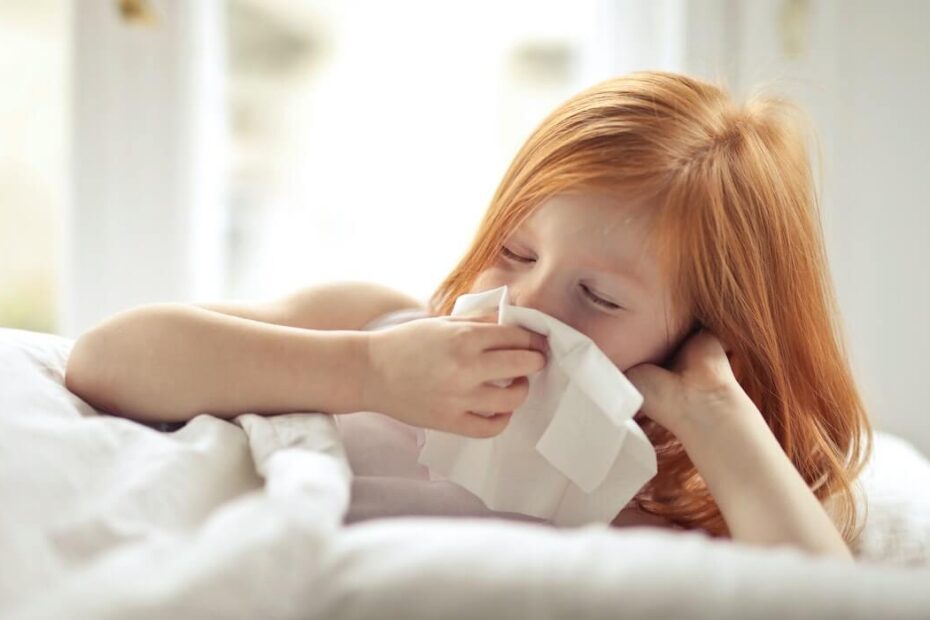 Girl Using Tissue to Blow Nose