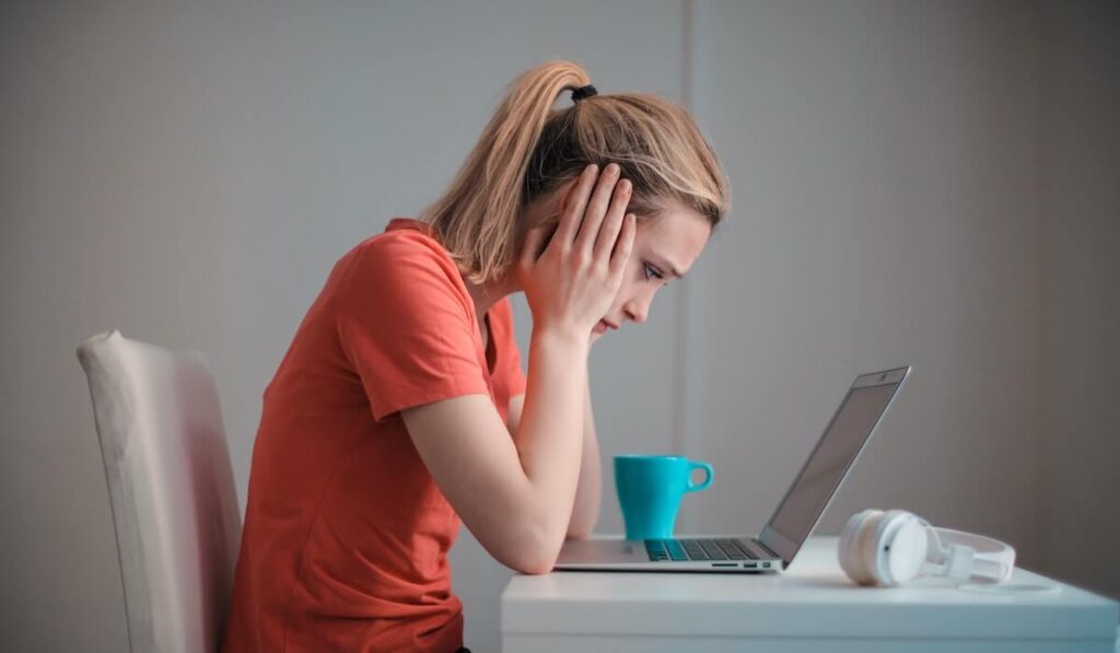 Young woman sitting at computer