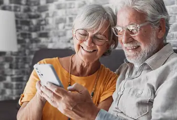 senior couple on mobile phone